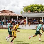 Energetic local soccer match with a vibrant crowd on a sunny day. — La Grada Online: Stay Updated with the Latest Sports News